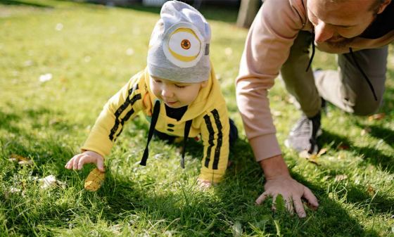 Dad plays with baby