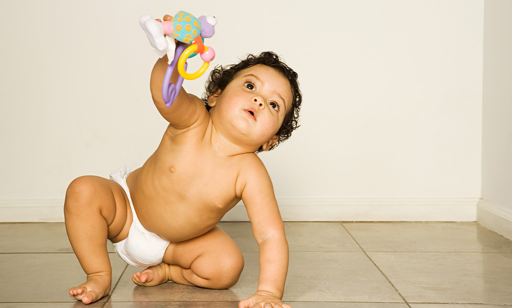 baby in half kneel position