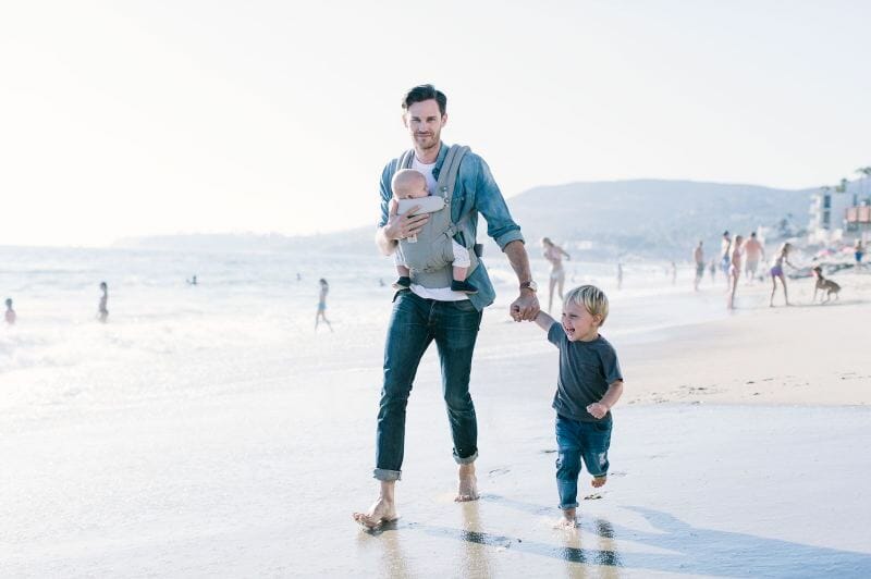 dad holding baby in ergobaby adapt carrier